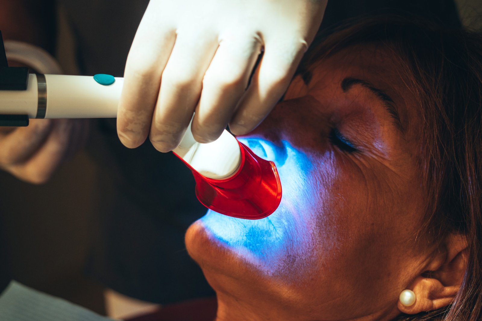 Caucasian Patient Goes To Dentist's Office For Teeth Whitening